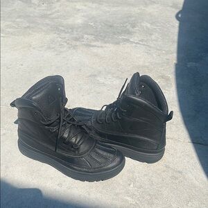 Sleek Black High-Top Boots with Sturdy Sole